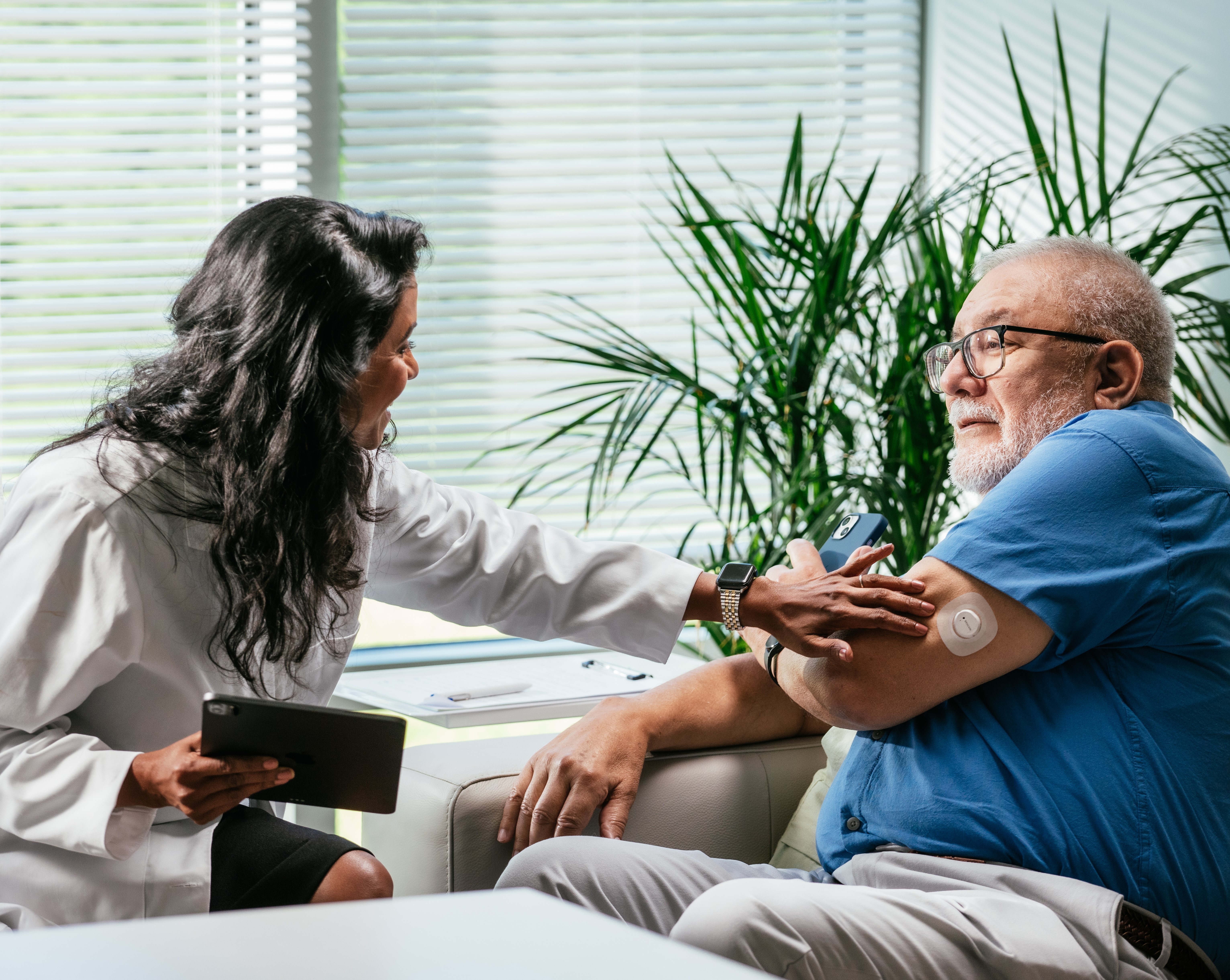 healthcare provider applying sensor to patient